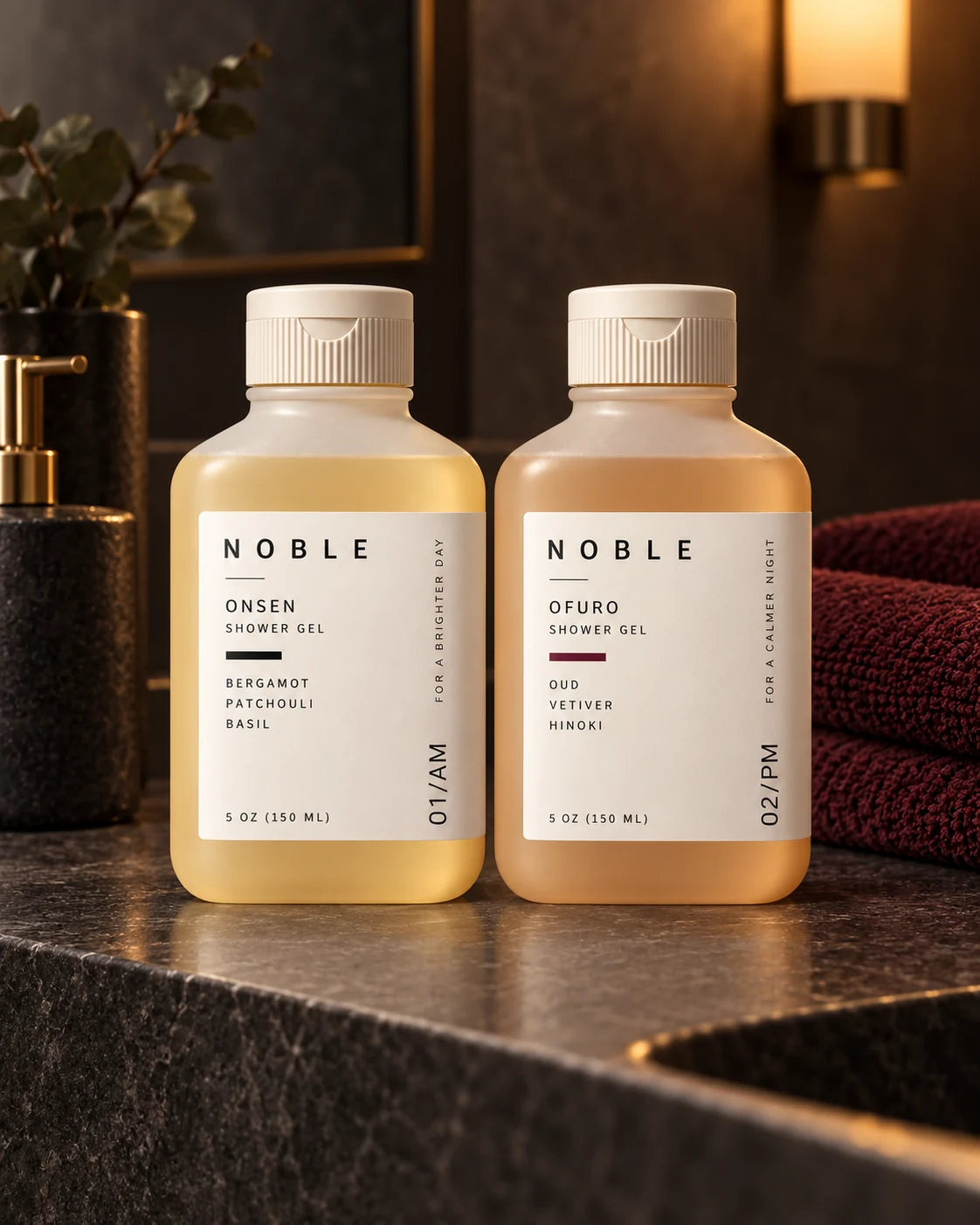 The ONSEN and OFURO 5 oz bottles on dark stone under a warm wall light