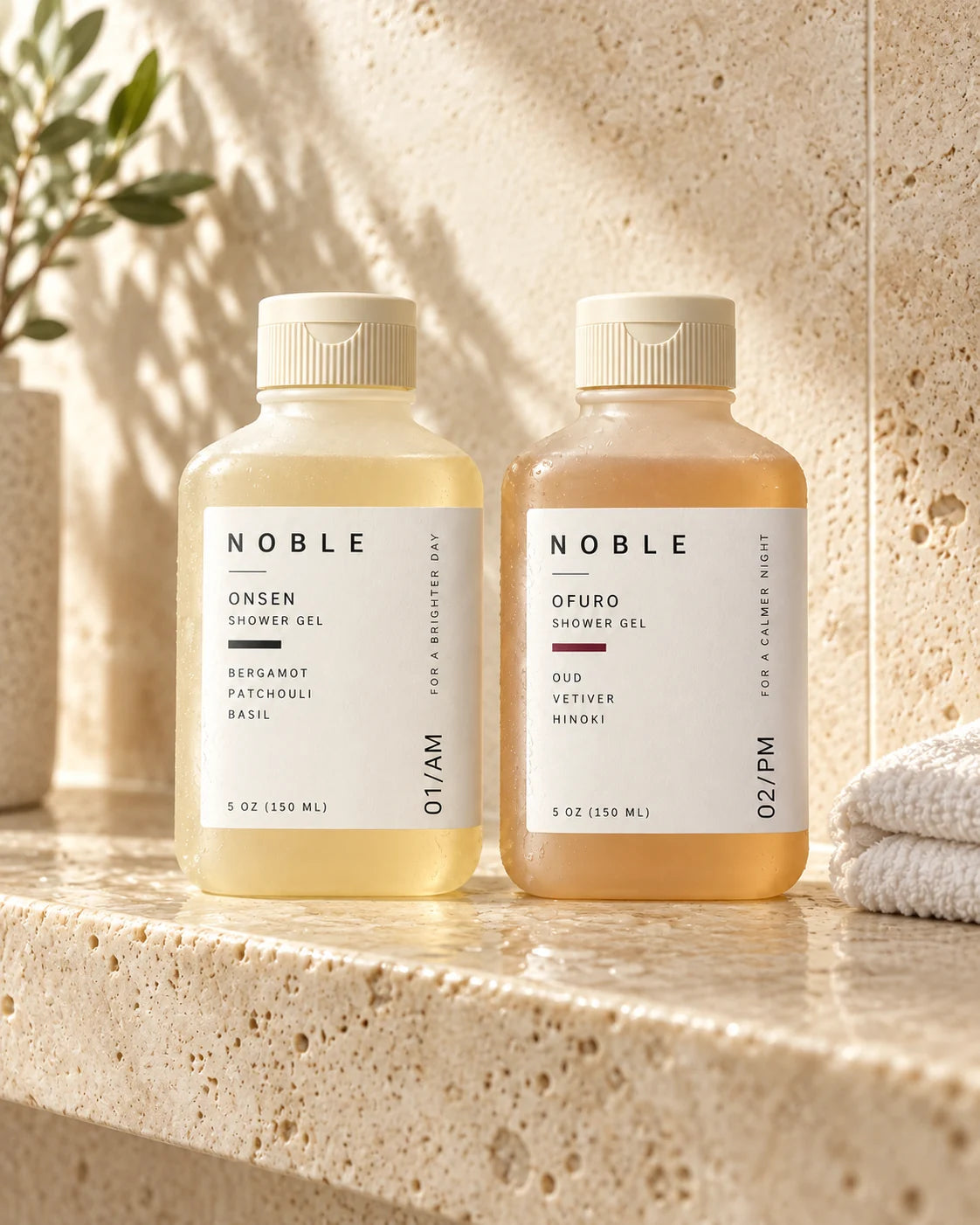 The ONSEN and OFURO 5 oz bottles on a sunlit stone ledge
